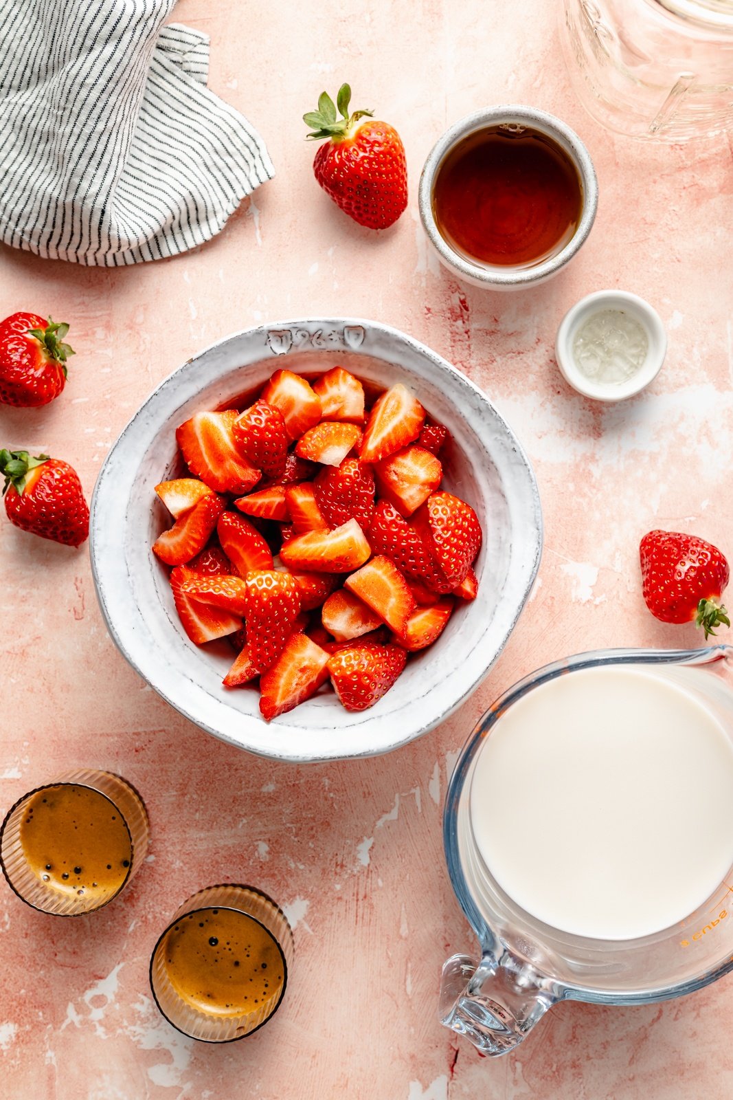 ingredients for a berry chantilly latte in bowls