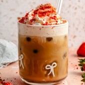 berry chantilly latte topped with whipped cream in a glass