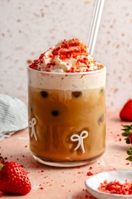 berry chantilly latte topped with whipped cream in a glass