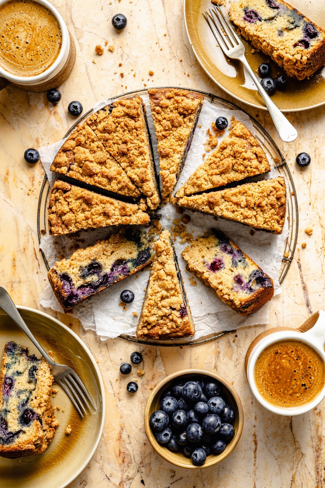 easy blueberry coffee cake sliced into triangle slices