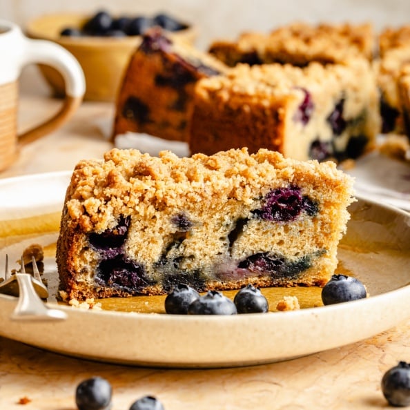 slice of blueberry coffee cake on a plate