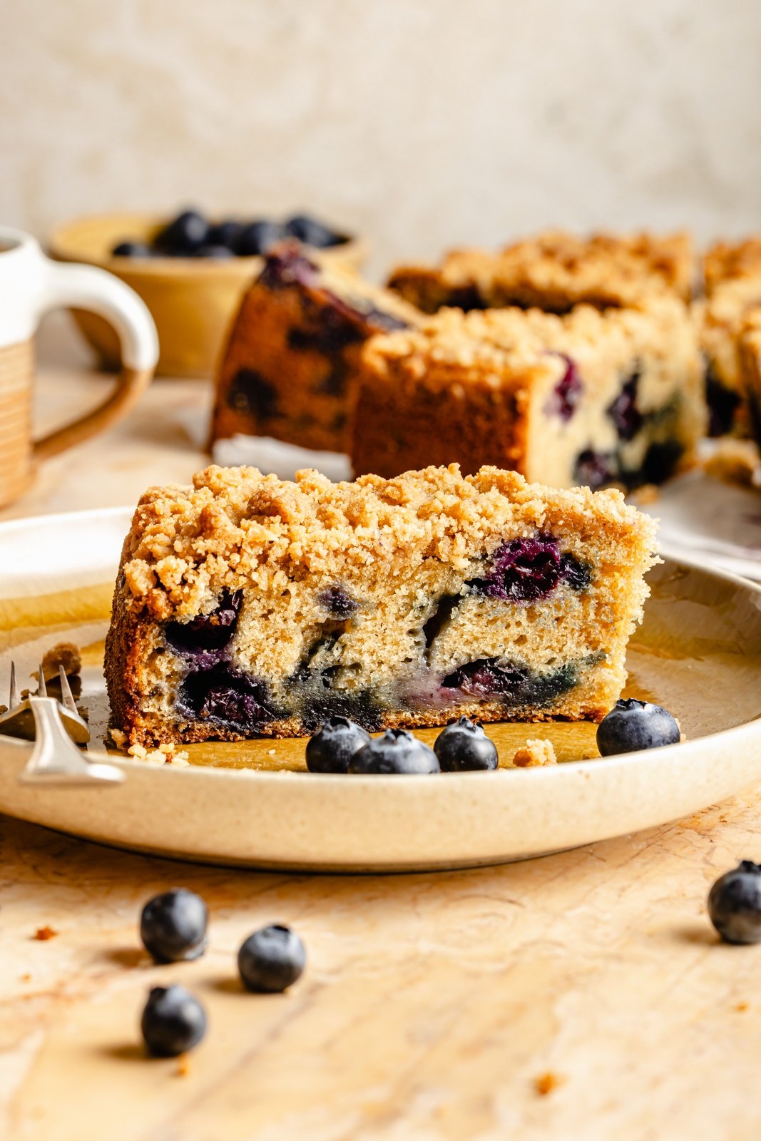 slice of blueberry coffee cake on a plate
