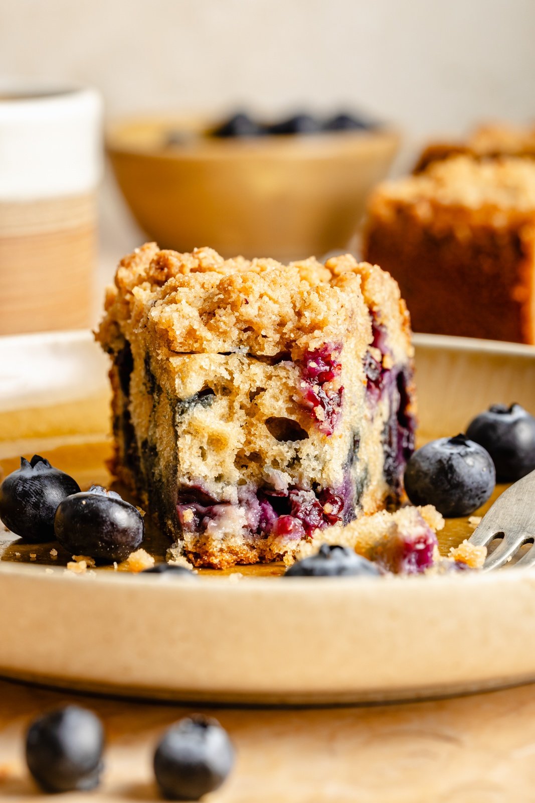 slice of blueberry coffee cake on a plate