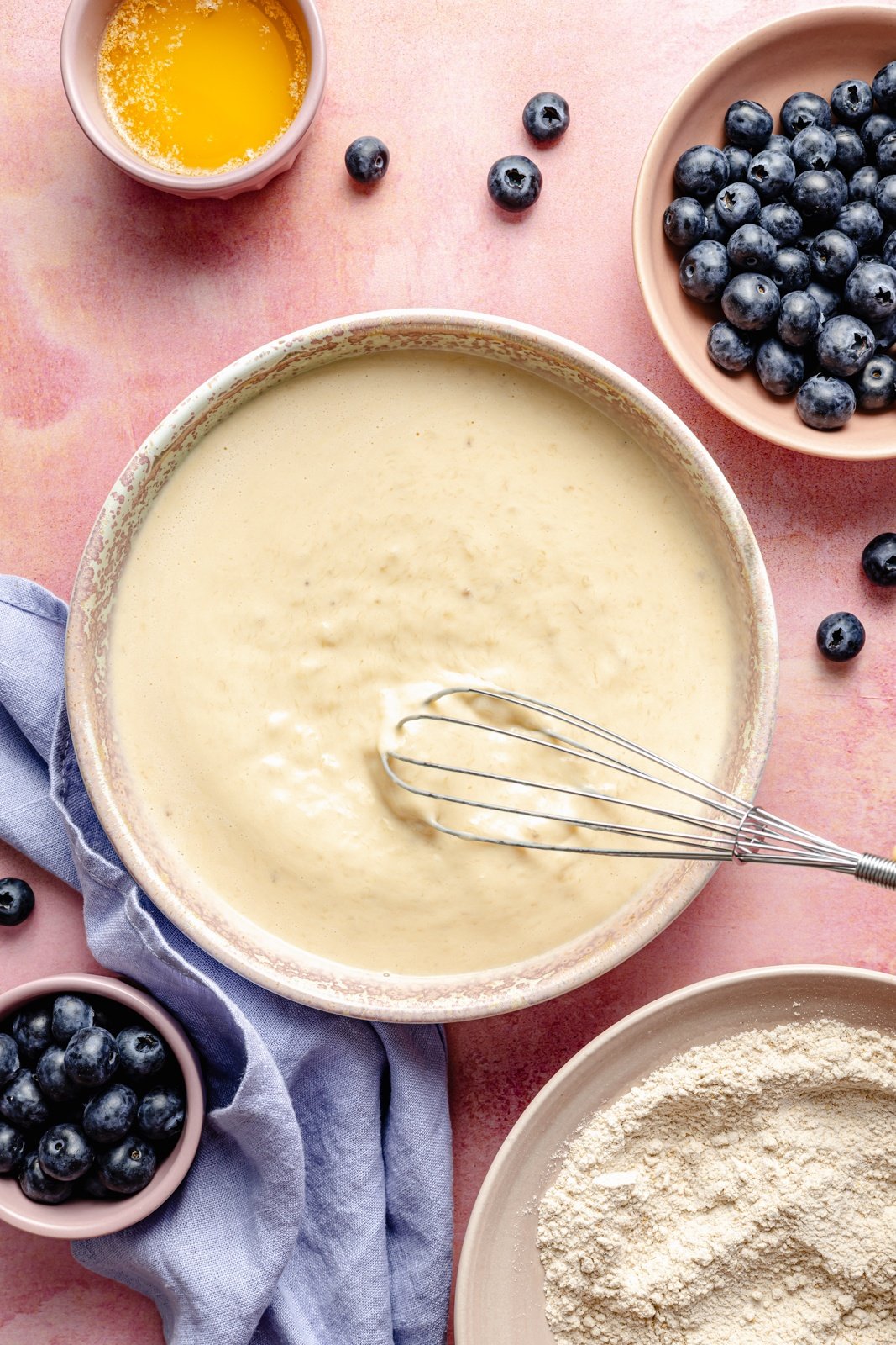 whisking batter for a pancake breakfast cake