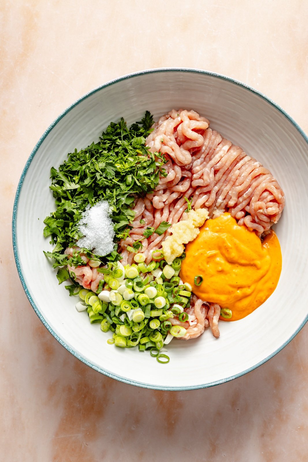 chicken mixture in a bowl to make smashed chicken tacos