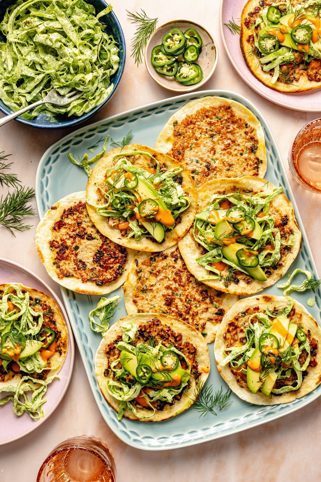 buffalo chicken smash tacos with slaw on a platter