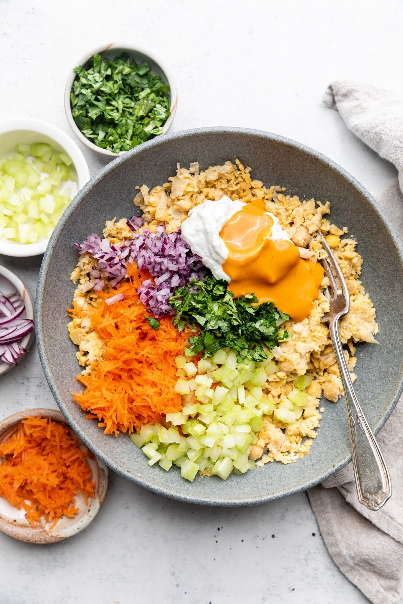 ingredients for easy buffalo chickpea salad wraps in a bowl
