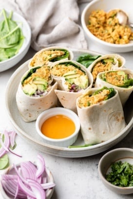 healthy buffalo chickpea salad wraps halved on a plate