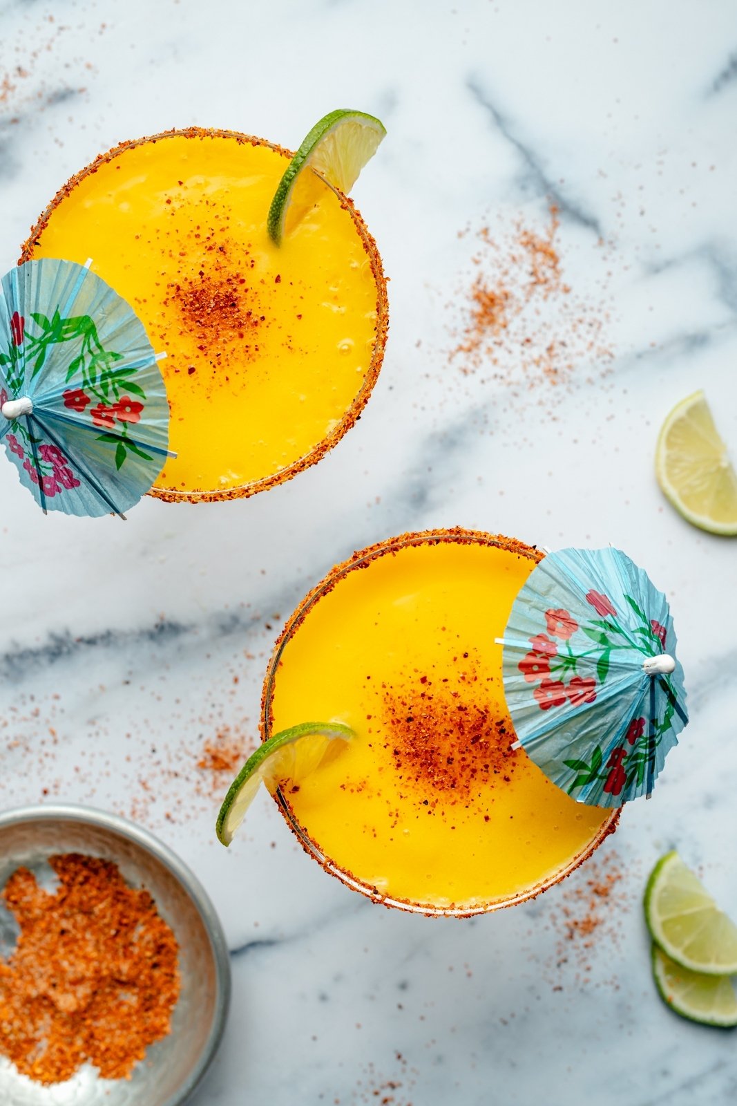 top-down view of two frozen mango margaritas