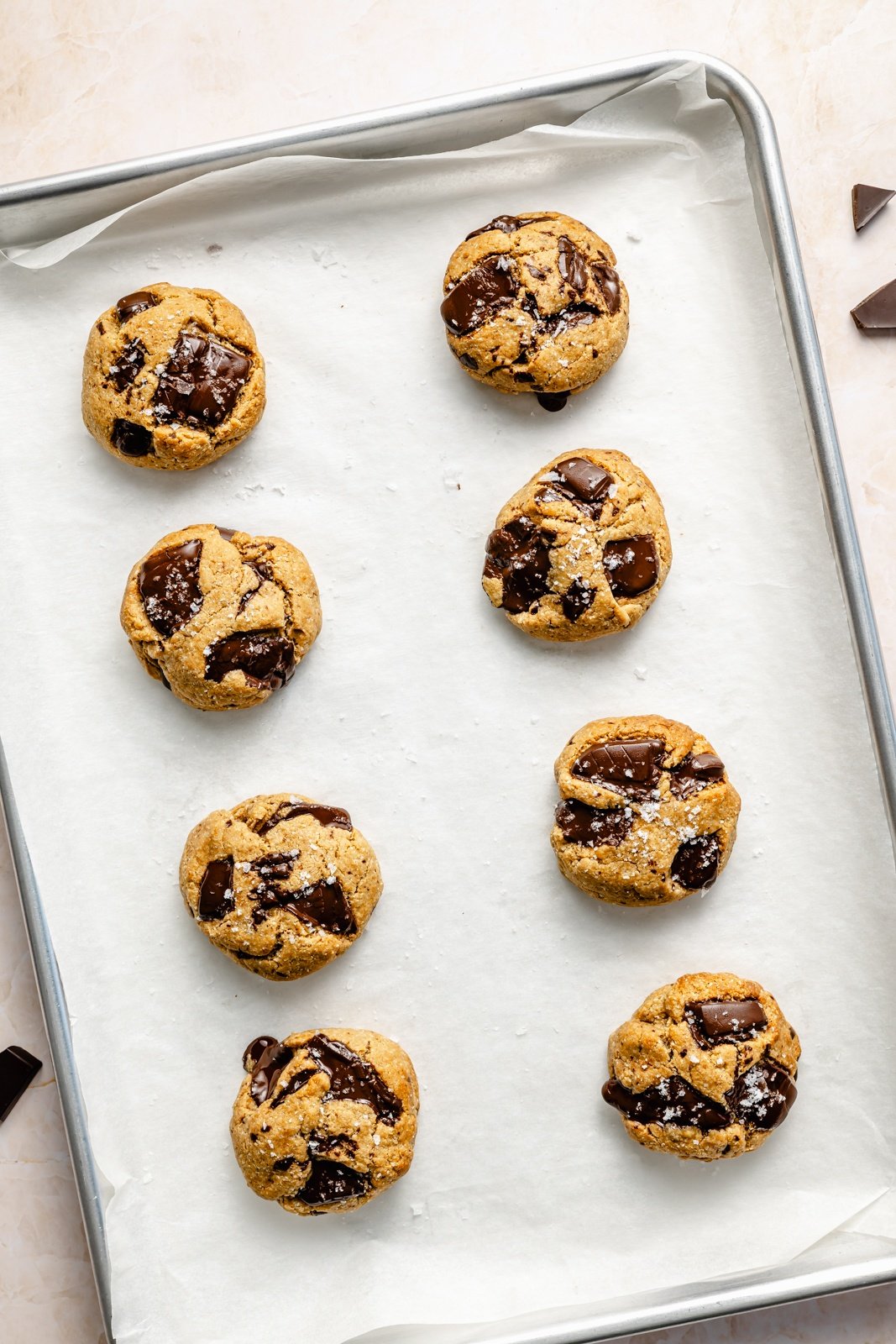 healthy peanut butter cookies with chocolate chunks on a baking sheet