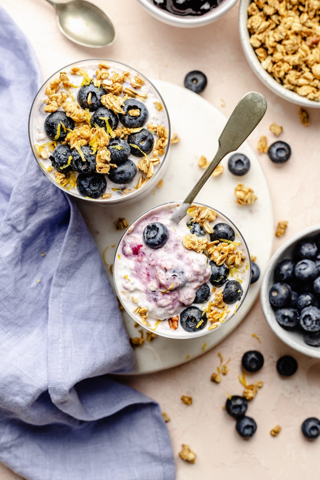 top-down view of two jars of lemon blueberry overnight oats