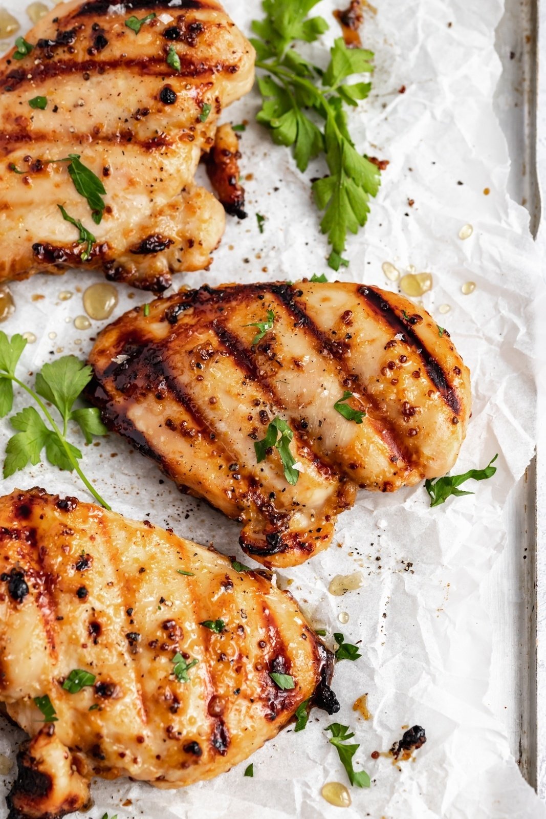 honey mustard chicken on parchment paper