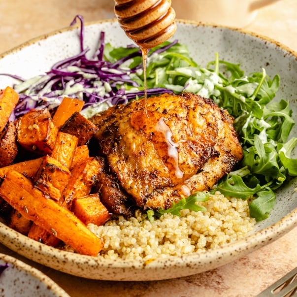 drizzling hot honey on hot honey chicken bowls