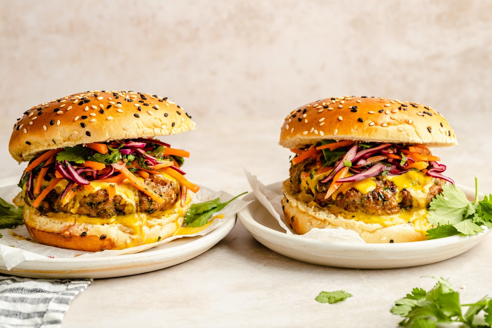 two curry turkey burgers on plates