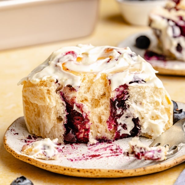 lemon blueberry sweet roll on a plate