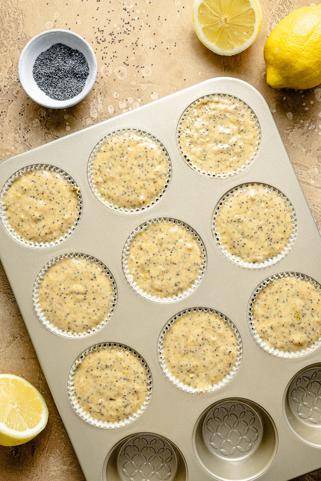 unbaked lemon poppy seed muffins in a muffin tin
