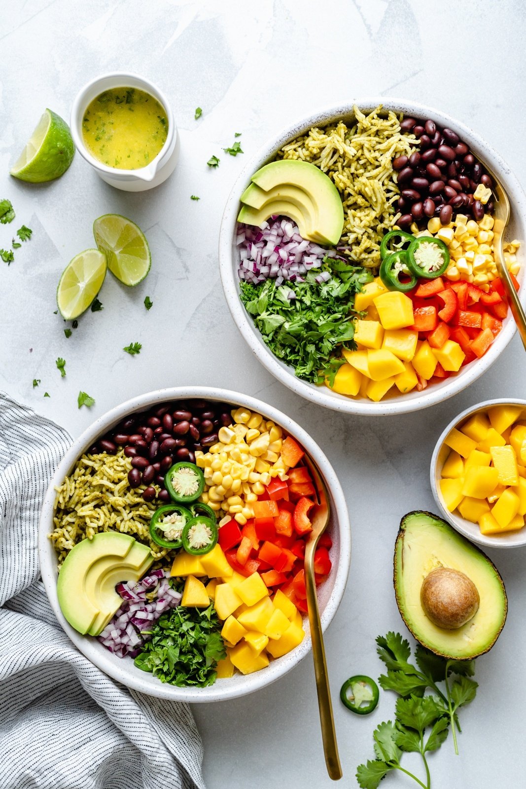 vegan green rice burrito bowls next to an avocado