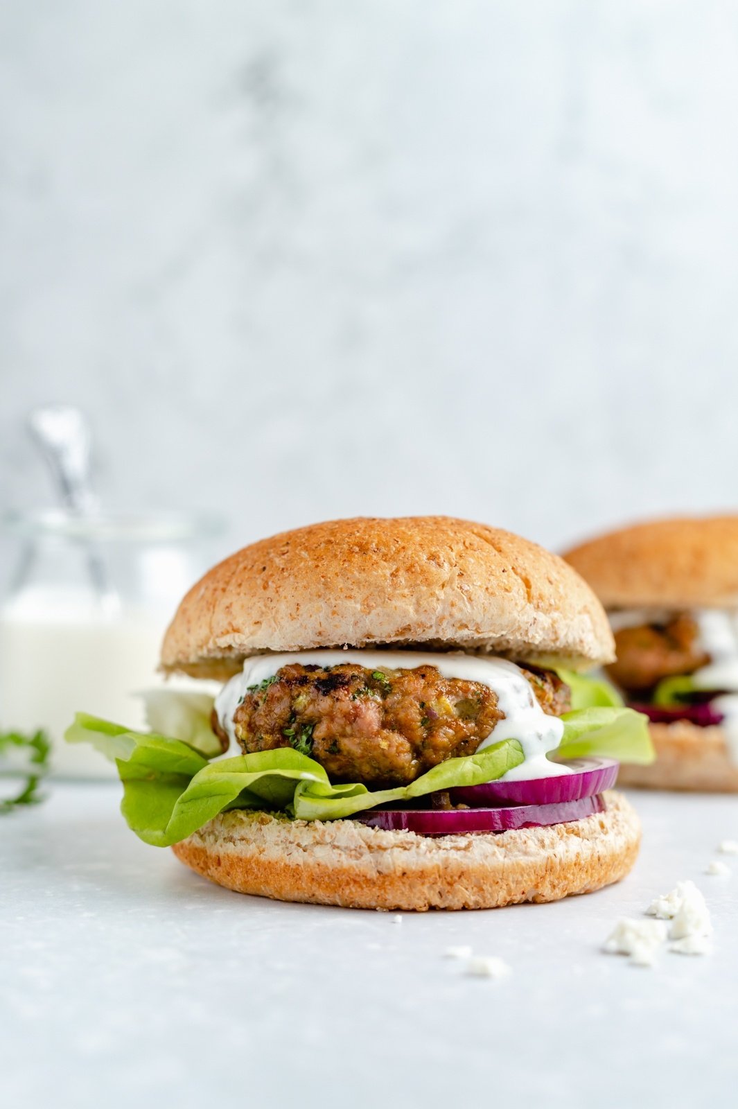 moroccan-inspired turkey burger topped with feta sauce