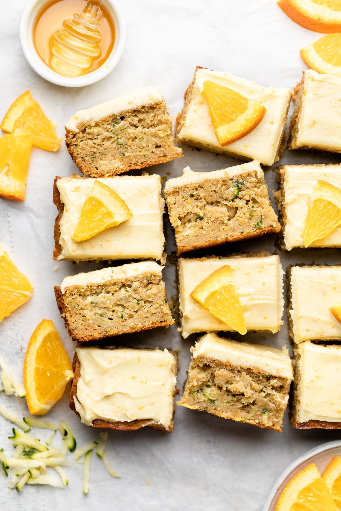 healthy orange zucchini cake sliced into squares