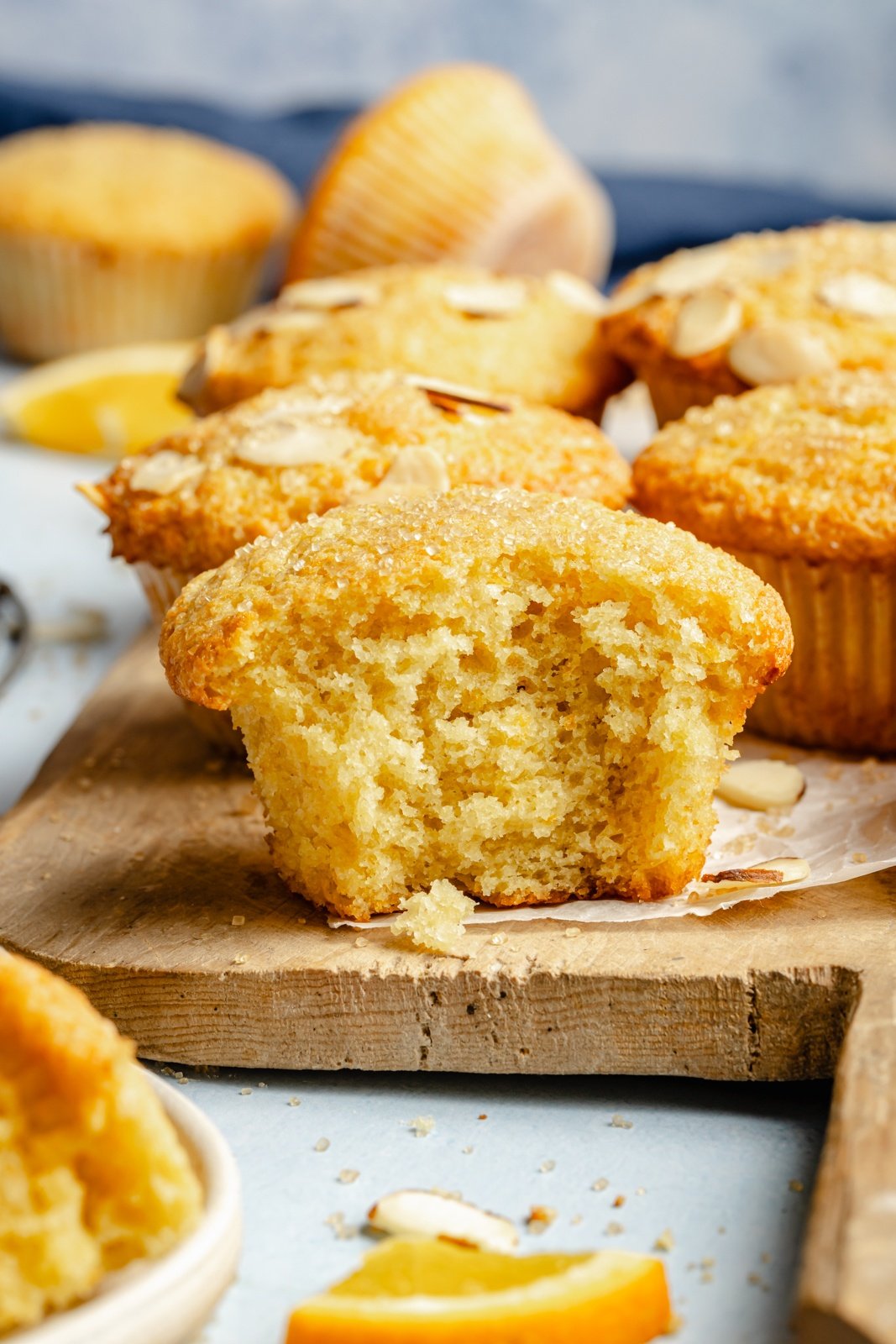 bakery-style orange muffin with a bite taken out