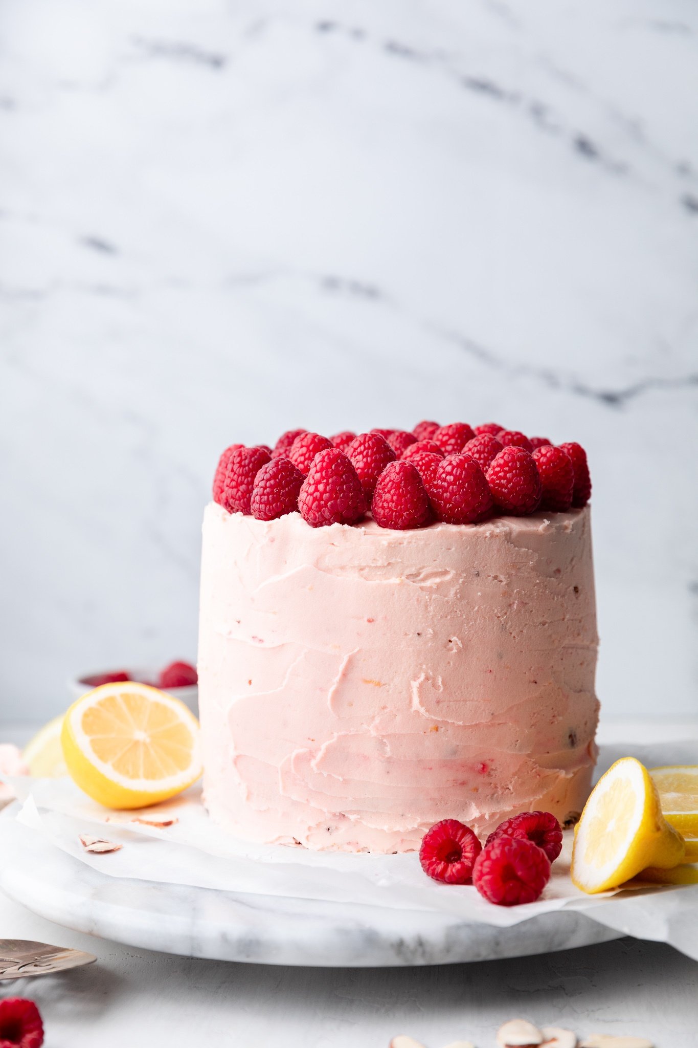 lemon raspberry cake topped with raspberries