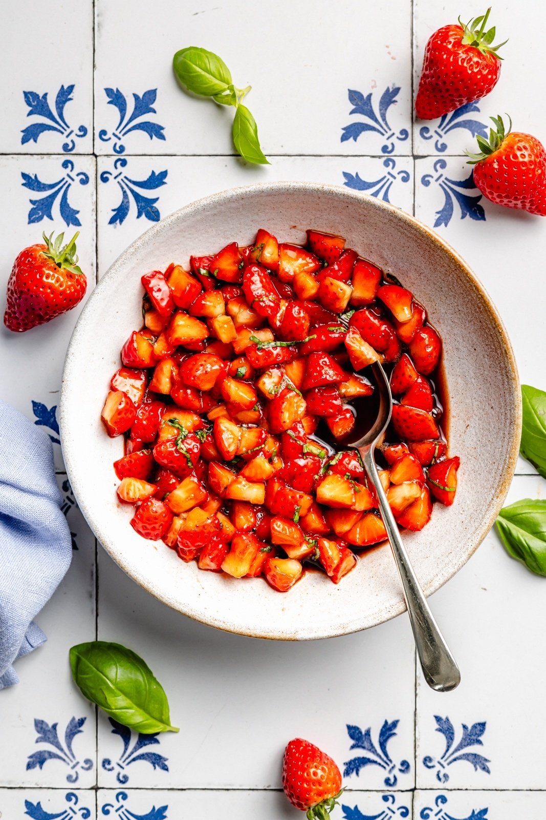 marinating strawberries to make strawberry balsamic bruschetta