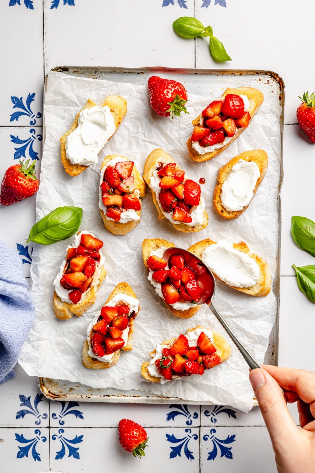 topping crostini with strawberry bruschetta