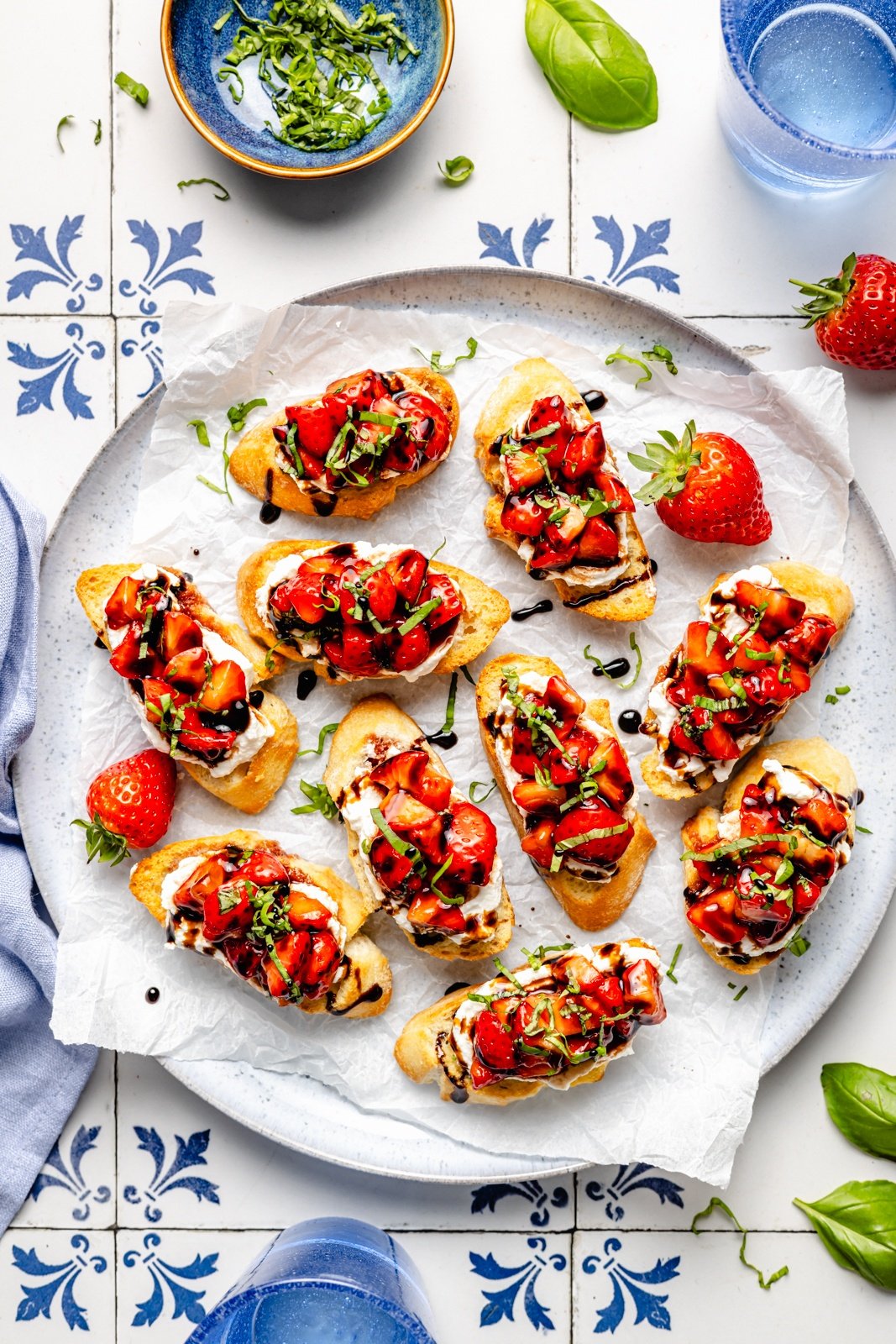 easy strawberry bruschetta drizzled with balsamic on a platter