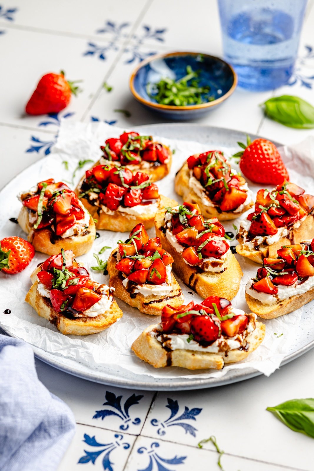 strawberry basil bruschetta on a round platter