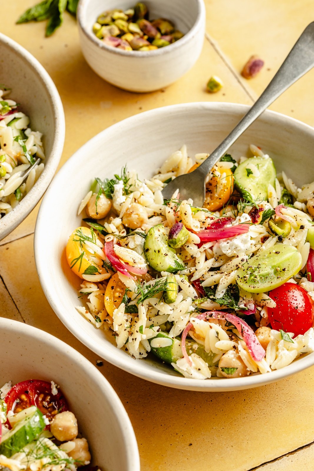 herby chickpea and feta pasta salad in a bowl