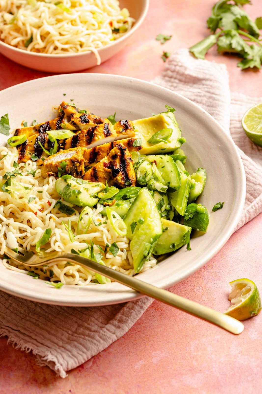turmeric chicken bowl with cucumber salad and ramen noodles
